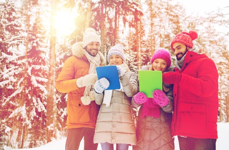 technology, season, friendship and people concept - group of smiling men and women with tablet pc...
