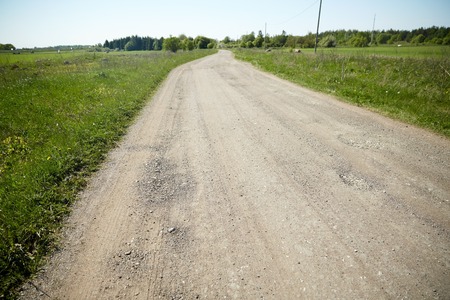 trip, travel and countryside concept - country road at summerの写真素材