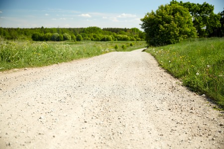 trip, travel and countryside concept - country road at summerの写真素材