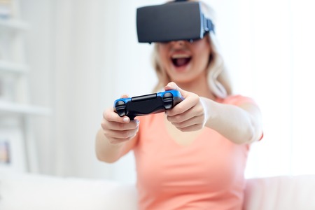 3d technology, augmented reality, gaming, entertainment and people concept - happy young woman with...