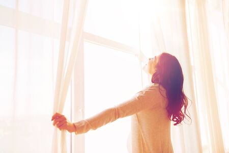 pregnancy, motherhood, people and expectation concept - close up of happy pregnant woman opening...