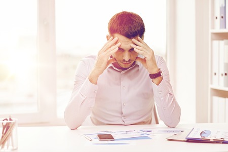 business, people, stress, deadline and technology concept - close up of businessman with smartphoneの写真素材