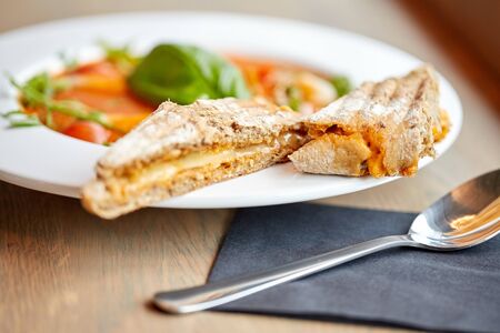 food, dinner, culinary, haute cuisine and cooking concept - plate of delicious gazpacho soup at restaurantの写真素材