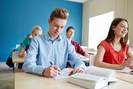 group of students with books at school lessonの写真素材