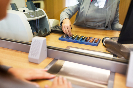 clerk counting cash money at bank officeの写真素材