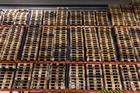 wooden cargo pallets storing at warehouse shelvesの写真素材