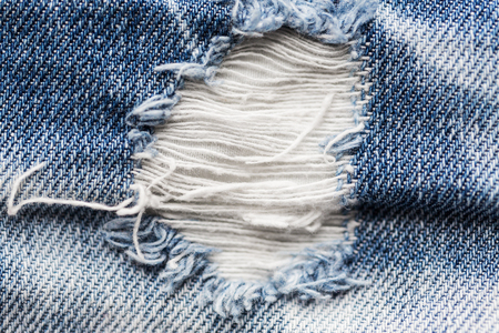 close up of hole on shabby denim or jeans clothesの写真素材