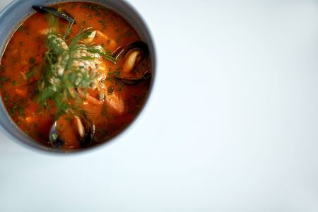 seafood soup with fish and blue mussels in bowlの写真素材