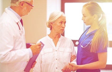medics and senior patient woman at hospitalの写真素材