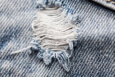 close up of hole on shabby denim or jeans clothesの写真素材