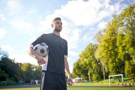 soccer player with ball on football fieldの写真素材