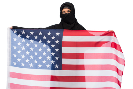 muslim woman in hijab with american flagの写真素材