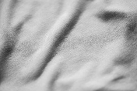 textile and texture concept - close up of gray cotton fabric backgroundの写真素材