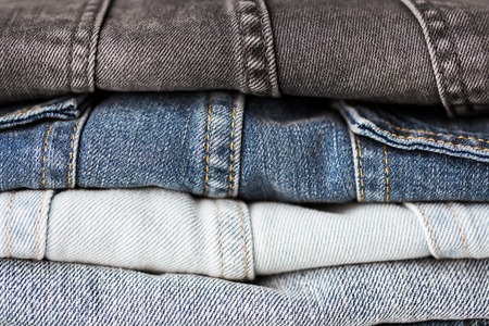 close up of denim clothes or jeans pileの写真素材