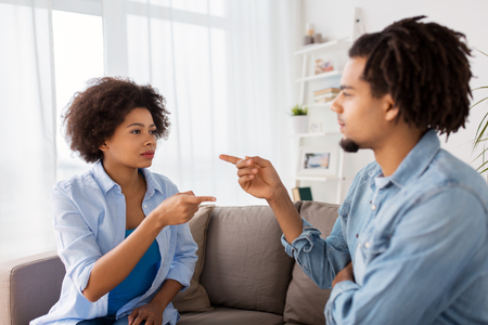 unhappy couple having argument at homeの写真素材