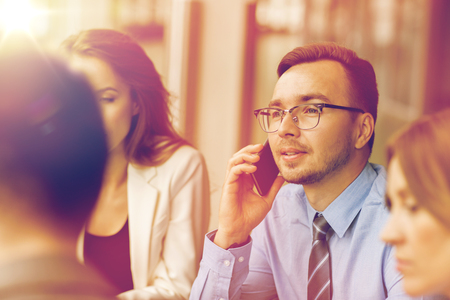 businessman calling on smartphone at officeの写真素材