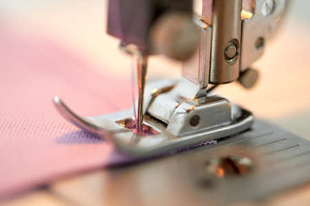 sewing machine presser foot stitching fabricの写真素材