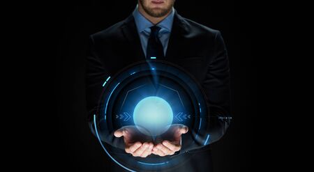 business, virtual reality, people and future technology concept - close up of businessman in suit with projectionの写真素材