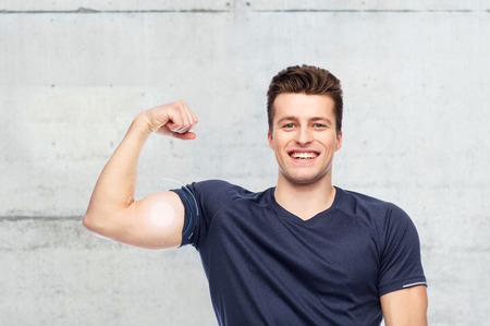 sportive man showing bicep power