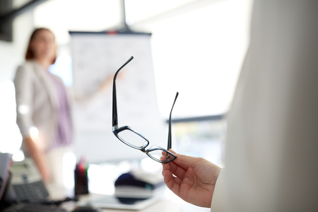 businessman with glasses at presentation in officeの写真素材