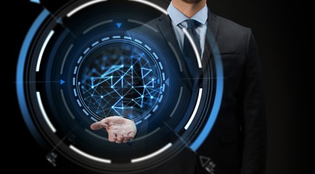 businessman with virtual projection over blackの写真素材