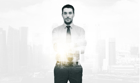 handsome businessman with crossed armsの写真素材