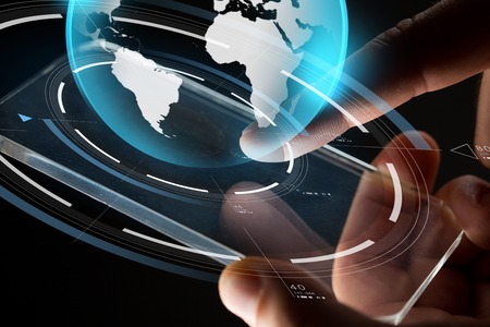 close up of hands with smartphone and earth