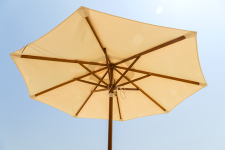 parasol over blue skyの写真素材