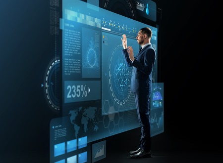 businessman with virtual screens projectionの写真素材