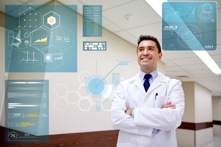 smiling doctor at hospital corridor