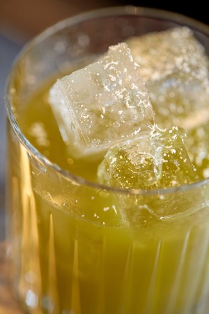 close up of glass with cocktail at barの写真素材