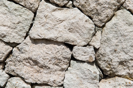 stonework, masonry, background and texture concept - grainy stone wallの写真素材