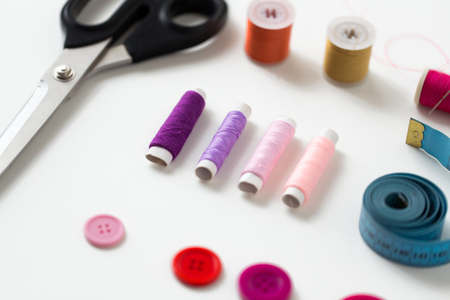 scissors, sewing buttons, threads and tape measure