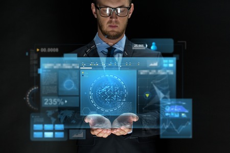 business, future technology, cyberspace and people - businessman with virtual screens projection over black backgroundの写真素材
