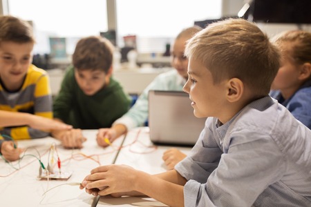 kids with invention kit at robotics school