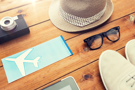 vacation, travel, tourism, technology and objects concept - close up of gadgets and traveler personal stuffの写真素材