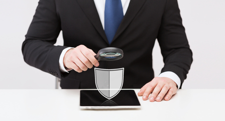 businessman with tablet pc antivirus program iconの写真素材