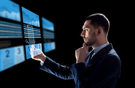 business, augmented reality and future technology concept - businessman in suit working with...