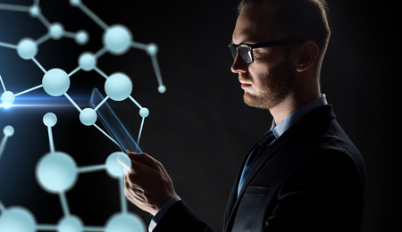 close up of businessman with transparent tablet pcの写真素材