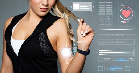 close up of sporty woman with fitness tracker