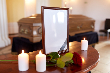 photo frame and coffin at funeral in churchの写真素材