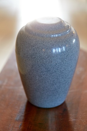 cremation urn on tableの写真素材
