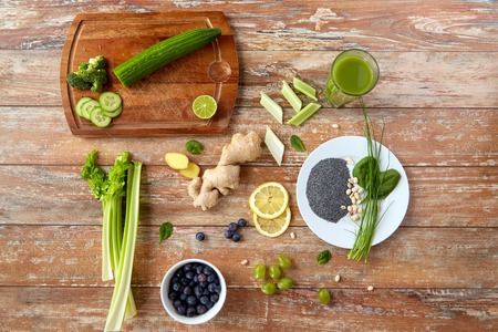 healthy eating, food and diet concept - fruits, berries and vegetables on wooden tableの写真素材
