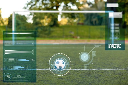 soccer ball and goal on football field