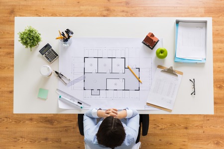 architect with house blueprint at officeの写真素材