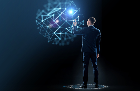 businessman in suit touching something invisibleの写真素材