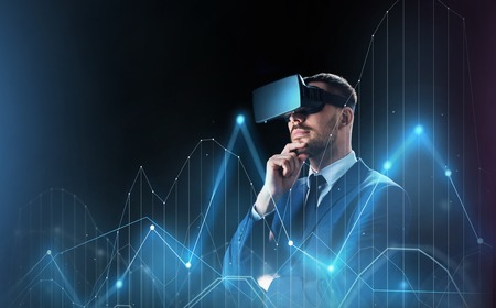 businessman with virtual reality headset and chartの写真素材