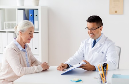 senior woman and doctor meeting at hospitalの写真素材