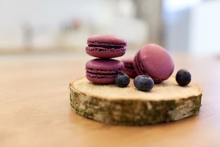 blueberry macarons on wooden standの写真素材
