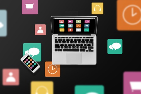 laptop computer with menu icons and smartphoneの写真素材